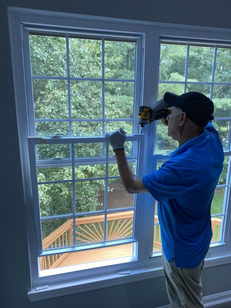 technician repairing home window safetywindowglassrepair safetywindowglassrepair