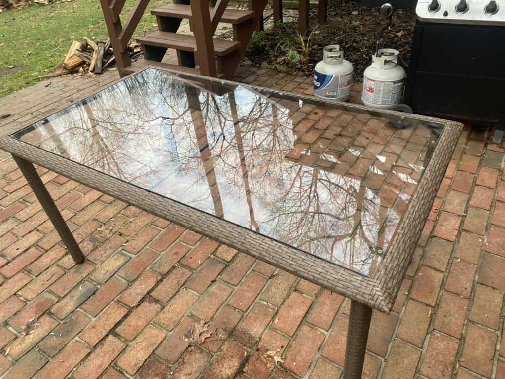 Custom outdoor glass table top installation